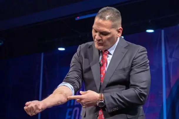 Pastor Roman Gutierrez speaking at an event
